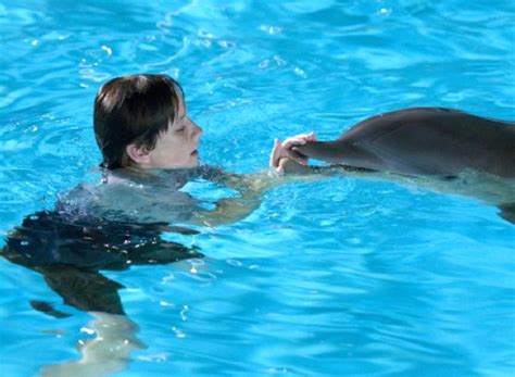 The dolphin swims again movie review (2011) .
